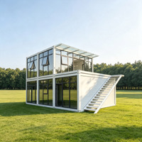 Villa préfabriquée de luxe sur mesure à deux étages, maison modulaire moderne avec mur-rideau en verre et escalier