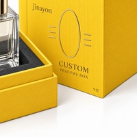 Kotak Parfum Tegak Berbahan Kertas Khusus Bertekstur Yolk Y17 dengan Logo Custom, Ukuran 10x10x14cm, Dilengkapi Busa Timbul dan Lapisan Foil Emas Matte