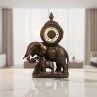 Horloge mécanique à mouvement automatique en laiton finition bronze, motif figuratif français antique « Éléphant et son bébé »