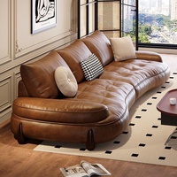 Canapé modulable en cuir Cognac Dune Cloud avec ottoman, pieds en bois capitonnés, accoudoirs rembourrés, mobilier de salon