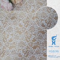 Tissu en dentelle brodée multicolore 100 % polyester de marque HG avec motif floral ajouré pour robe de soirée