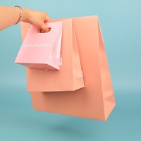 Sacs en papier kraft brun écologiques personnalisés avec poignées découpées, logo imprimé, finition mate, options de taille pour les marques