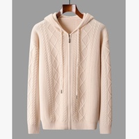 Cardigan zippé à capuche pour homme en laine mérinos 100% avec logo personnalisé OEM, tricot torsadé, texture jacquard, coupe ample, pull d'hiver tricoté
