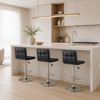 Tabouret de bar contemporain noir matelassé, pivotant et réglable en hauteur, pour îlot de cuisine, bar, café, ou espace artistique