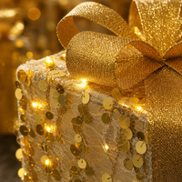 Coffret Cadeau Scintillant Doré en Fer avec 3 LED Chaudes et Nœuds Pailletés – Vente Directe Usine pour Décoration de Noël, Arbre de Noël, Cheminée et Table de Fête