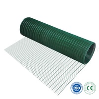 Alternative au clôture en bois sans entretien : Rouleau de grillage soudé en PVC vert, résistant à la décomposition, pour des maisons modernes et écologiques