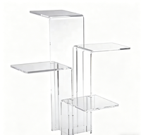 Support de présentation multi-niveaux en acrylique transparent avec plateformes escalonpées pour desserts, parfums et présentation de table de buffet de mariage