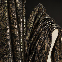 Vente en gros de tissu jacquard métallisé noir et or tissu ondulé tissu brocart à motifs irréguliers pour robe de créateur