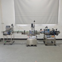 Ligne de remplissage automatique de liquides à petite échelle avec pompe magnétique, bouchonneuse et étiqueteuse de bouteilles