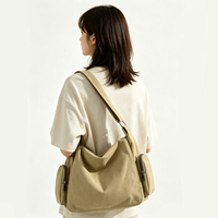Sac bandoulière hobo en toile grande capacité, décontracté et souple, avec poches latérales, idéal pour les trajets quotidiens, l'école et le shopping