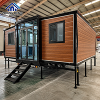 Maison conteneur de luxe extensible à double aile en acier de 20 et 40 pieds avec porte vitrée, villa modulaire préfabriquée, entrepôt, résidence de villégiature