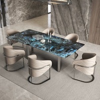 Meubles de salle à manger modernes pour la maison, fabriqués en Chine, table à manger rectangulaire en marbre naturel haut de gamme et stable avec chaises confortables.