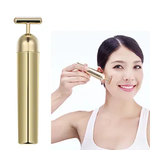 Suministros de fábrica 24K chapado en oro en forma de T masajeador cara vibratoria de mano impermeable jowl lifting T shape Beauty Bar