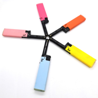 Briquet portable FV72 avec corps noir, levier coloré et réservoir de carburant en plastique