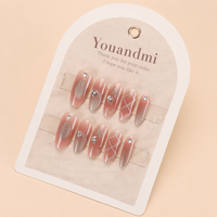 Faux ongles virals faits main en forme d'amande Xiaohongshu, motifs papillon et œil de chat en strass, style salon séduisant