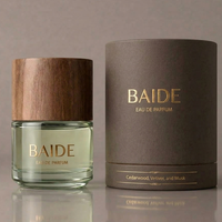Botella de Perfume de Vidrio Transparente Cilíndrica Personalizada con Logotipo Dorado de 30 ml, 50 ml, 100 ml, con Pulverizador y Tapa de Madera
