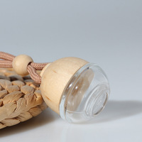 Mini diffuseur de parfum pour voiture rond suspendu en verre avec bouchon en bois et logo laser