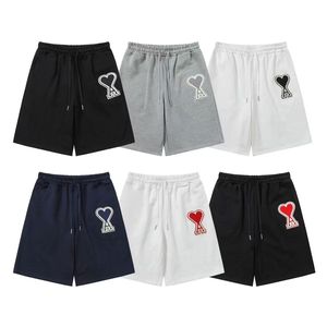 Nuevos pantalones deportivos de marca a la moda para el verano, pantalones cortos holgados y versátiles con bordado para hombre y mujer, pantalones cortos AMI para parejas - Product Image 1
