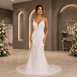 Robe de mariée moderne sans manches à col rond, ornée de perles et de broderies en cristal, avec jupe en satin drapé, taille naturelle, longueur ras du sol et traîne. - Product Image 1