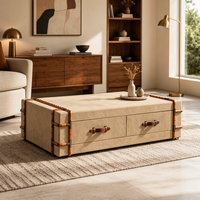 Table basse de rangement rembourrée de style coffre avec deux tiroirs et détail de sangle décorative pour salon