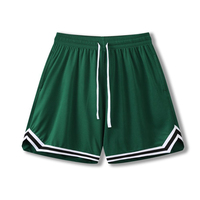 Shorts de sport pour hommes et enfants, tissu polyester, coupe ample, séchage rapide. Idéal pour le football, la course à pied et l'entraînement physique.