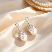 Boucles d'oreilles pendantes coréennes tendance en cuivre avec grandes perles et zircons pavés en forme de goutte, inaltérables, bijoux de mariage pour femmes 2026