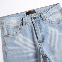 Jean slim bleu pour homme, effet usé, avec patch en cuir personnalisé, en denim extensible, style urbain, logo OEM