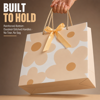 Sac en papier cadeau imprimé sur mesure, recyclable, biodégradable, en papier couché avec poignée en corde pour boutique de détail
