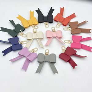 Luxury Women's PU Leather Bow Keychain and Handbag Pendant Charm <b>Cute</b> Car Brand Keychain for Business Promotional Gifts - Product Image 2