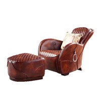 Fauteuil d'appoint vintage en cuir avec ottoman, matelassage losanges, détails anneaux métalliques, chaise longue individuelle rétro pour bureau ou bar