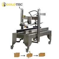 Machine de scellage de cartons entièrement automatique en acier inoxydable Goldtec GTF-AT5050G avec système de pliage de rabats et de collage de ruban adhésif
