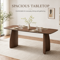 Table à manger de style européen moderne en bois d'acajou avec plateau en oxyde de magnésium à bords arrondis et pieds incurvés