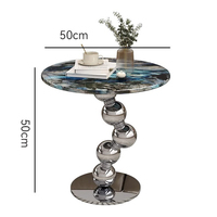 Table basse moderne en pierre frittée avec structure en acier inoxydable argenté – Design durable, écologique et pratique pour votre salon