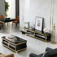 Table basse de luxe en marbre noir avec espace de rangement pratique et piètement en acier inoxydable doré pour salon