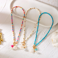Nouveau Collier Bohème Plaqué Or avec Perles Turquoises Colorées, Coquillages et Pendentifs Étoiles – Vente en Gros Transfrontalière
