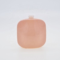 Flacon de parfum en verre rose de luxe de 50 ml, nouveau design féerique, avec bouchon rond, fabrication en usine, étiquette privée personnalisée, vente en gros en vrac