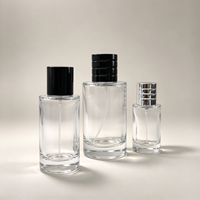 Flacon de parfum en verre transparent rond de 25 ml, 50 ml, 100 ml, flacon atomiseur de parfum vide avec bouchon côtelé noir et argenté