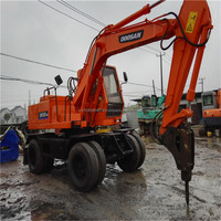 Excavatrice sur pneus Doosan Dh130 d'occasion Excavatrices sur pneus Doosan 130 140 d'occasion à vendre