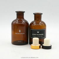 Vente en gros Bouteille vide ronde de luxe avec diffuseur d'arôme en verre ambré 125ml 250ml