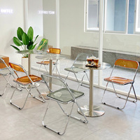 Café-Tisch-und-Stuhl-Set, Runder Edelstahltisch, Transparente Acryl-Klappstühle, Platzsparende Esstisch-Sets