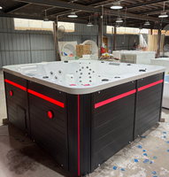 Spa de jardin extérieur en acrylique avec panneau intelligent, chauffage à température constante, massage à bulles, fonction surf et éclairage LED avec jupe décorative