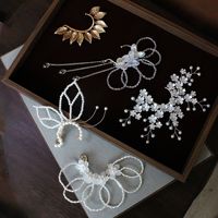 Boucles d'oreilles clipsables sans perles, style elfique, inspirées de la forêt blanche, luxueuses, de style européen et américain, avec fleurs de cerisier, en cristal fait main