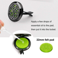 Parfum de voiture en acier inoxydable Aromathérapie Rafraîchisseur d'air Parfum Diffuseur d'huiles essentielles Médaillon noir avec clip d'aération 12 tampons en feutre