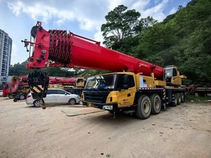 Grue de chantier SA-NY STC1000 d'occasion en excellent état, forte puissance de levage pour les travaux d'infrastructure et d'installation d'équipements - Product Image 1