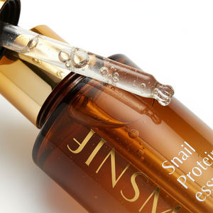 Essence légère à la mucine d'escargot à effet apaisant, sérum quotidien pour tous types de peau, production personnalisable directe usine - Product Image 1