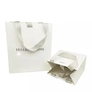 Custom Logo Printed Luxury Merchandise Retail White Cardboard Packaging Paper Bags For Clothes Clothing