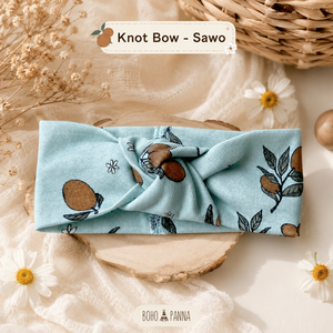 Adorable sapodilla knot bow with soft fabric secure fit and timeless elegance perfect for parties photos and everyday styling - Product Image 1