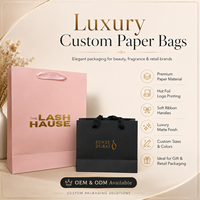 Sac de shopping en papier kraft recyclé noir mat de luxe personnalisé avec logo en feuille d'or et poignée en corde de coton pour l'emballage de vêtements