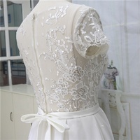 Illusion Luxury Lace Beading Wedding Dress A-Line Robe de mariée à manches courtes avec train court Taille naturelle Longueur au sol avec ceinture