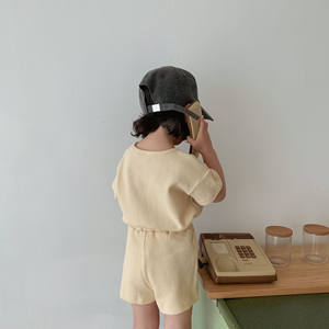 Conjunto de dos piezas para niñas: Camiseta de algodón con cuello redondo y pantalones cortos tipo waffle con botones, estilo coreano. - Product Image 6